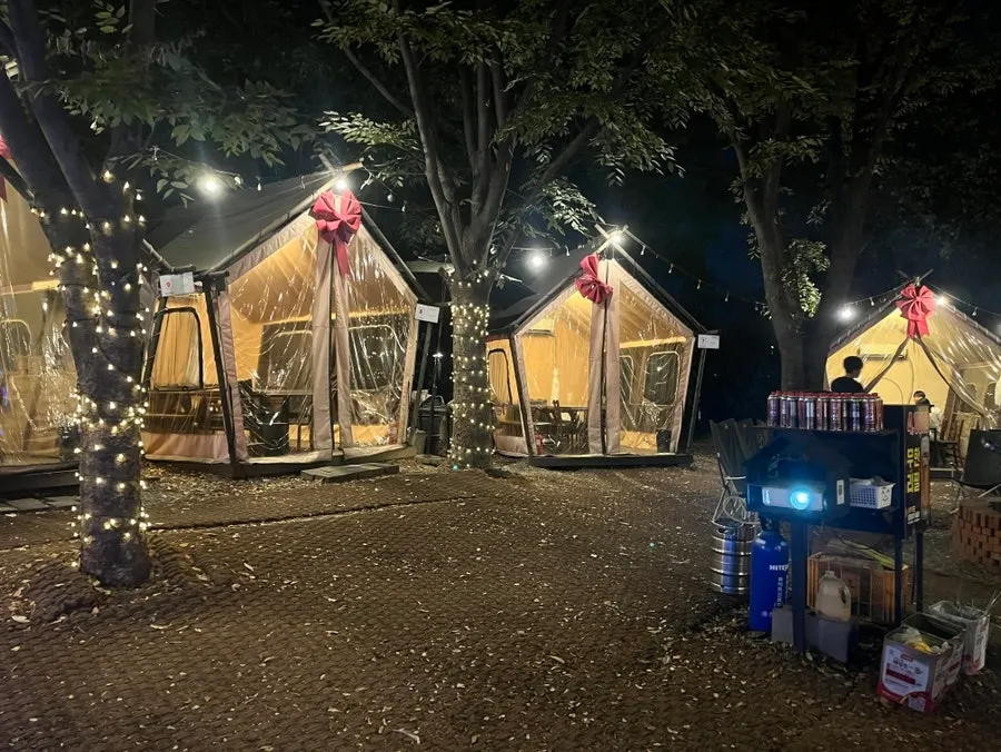 Outdoor tables set up like a campsite