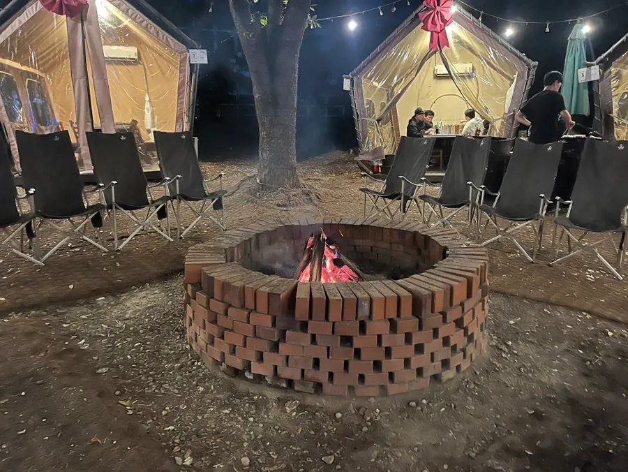 Outdoor tent seating for grilling meat