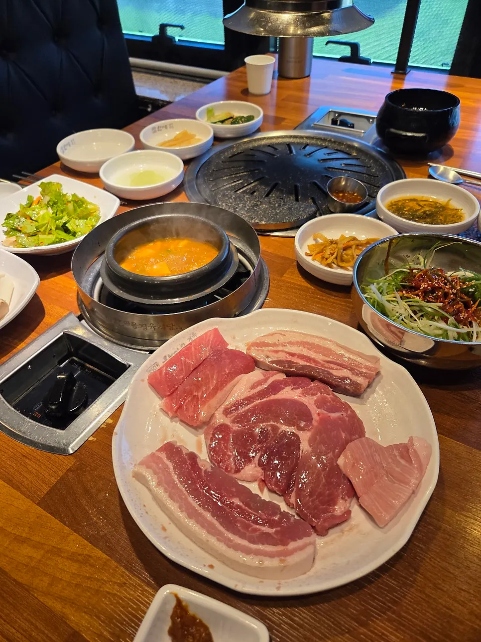 Raw cuts of pork including samgyeopsal and hangjeongsal