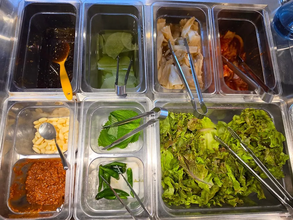 Self-serve bar with kimchi and lettuce wraps
