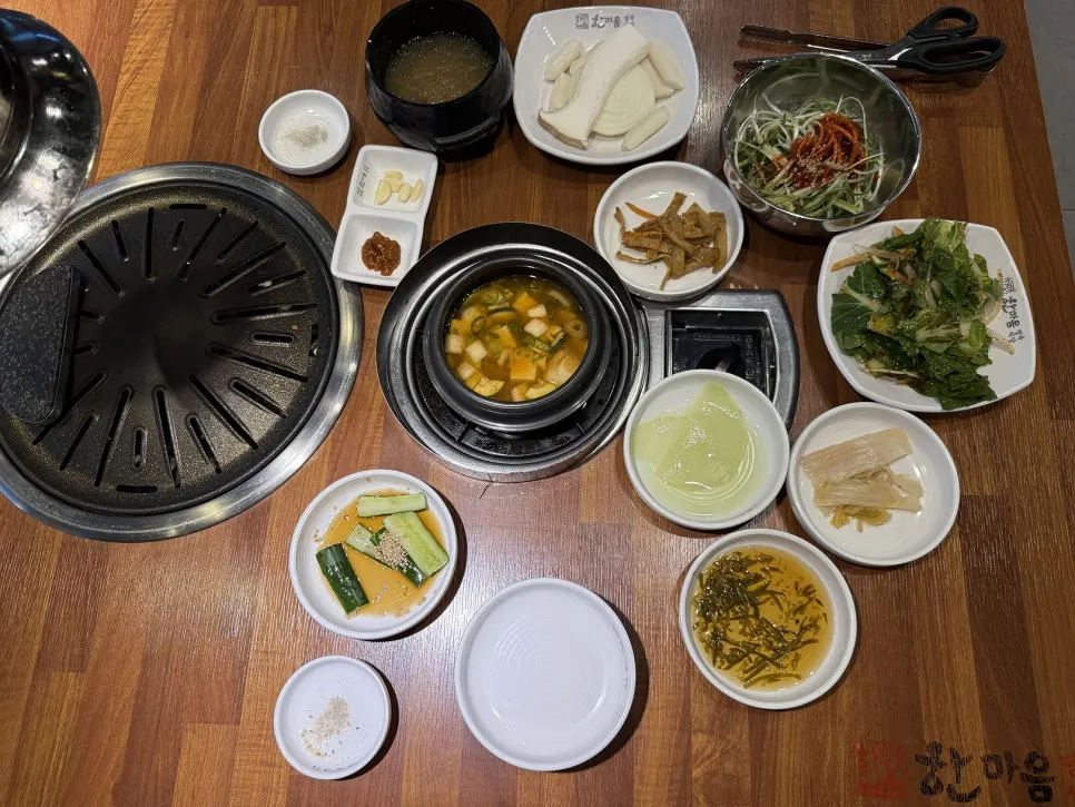 Table with basic side dishes and doenjang jjigae
