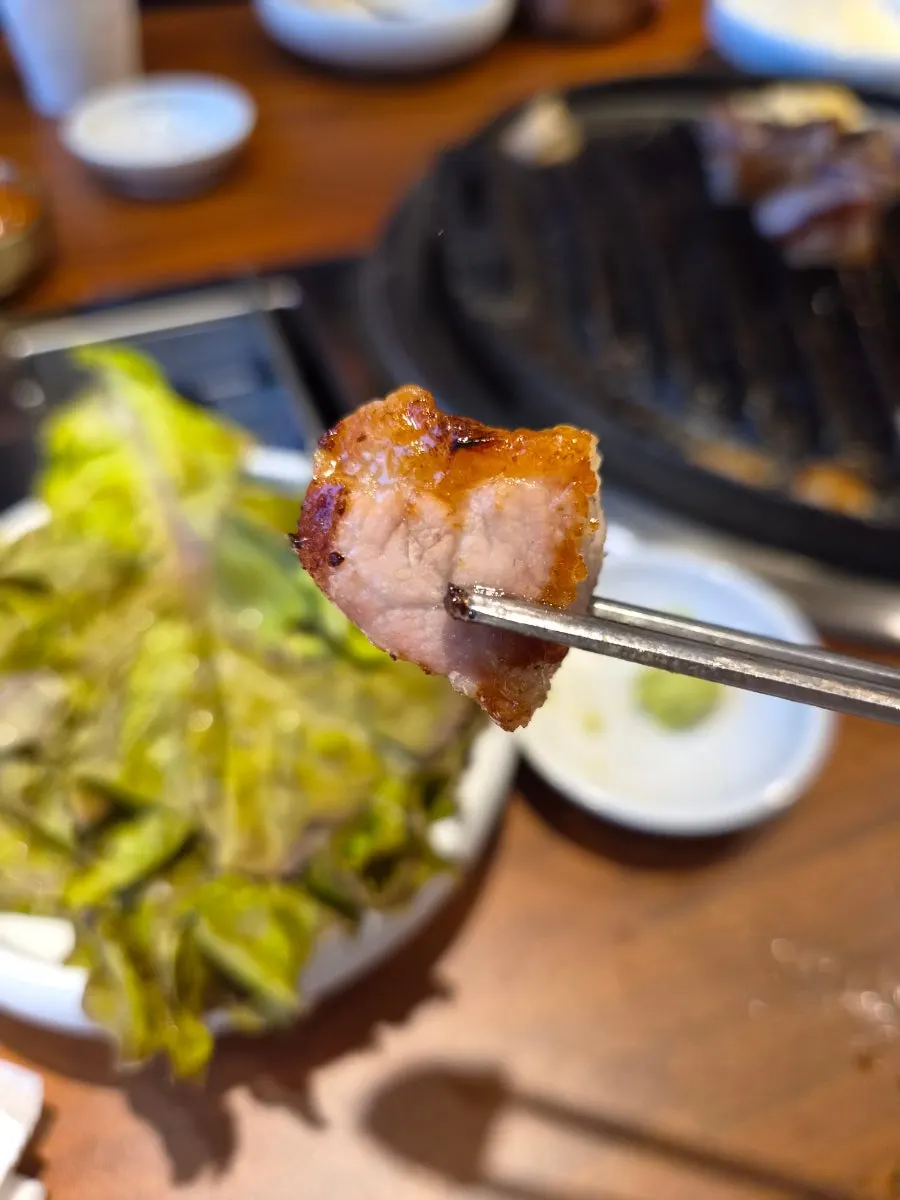 Pork skirt and jowl cooking on the grill