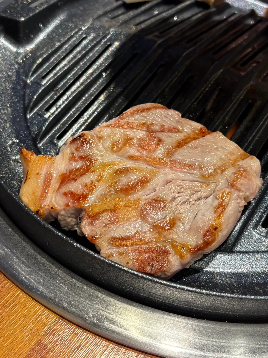 Thick pork belly grilling on the hot plate