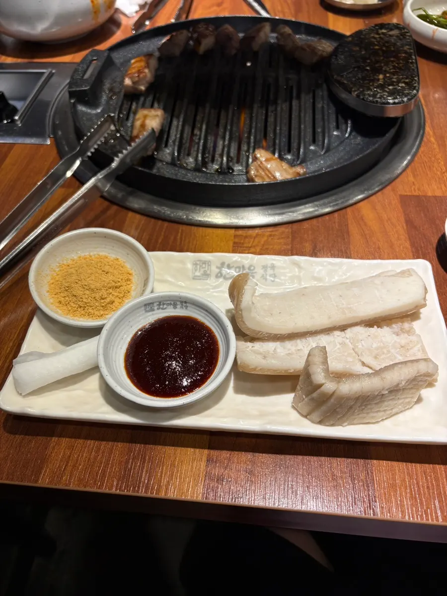 Pork skin grilling on the hot plate