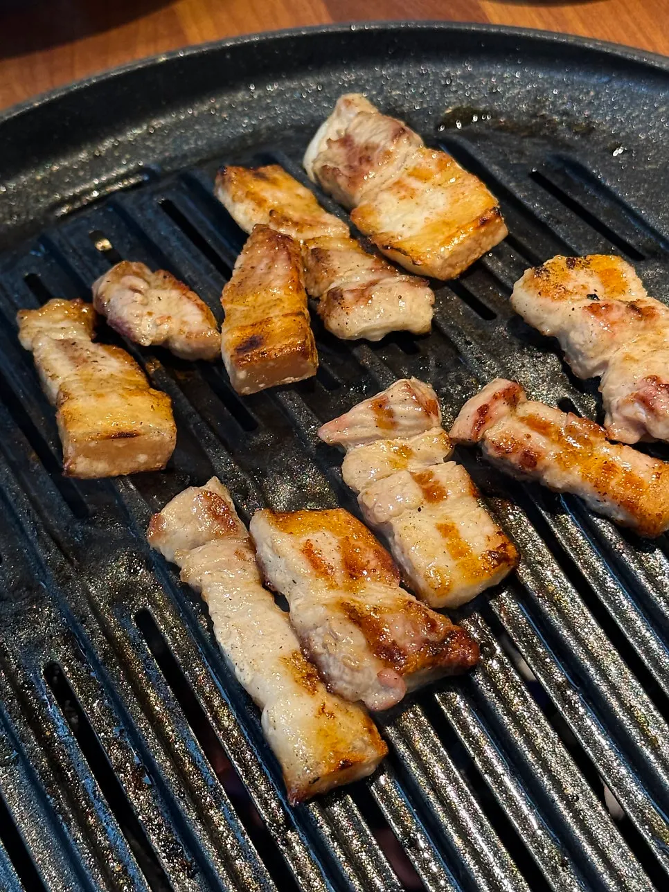 A piece of thick-cut pork belly grilled to perfection