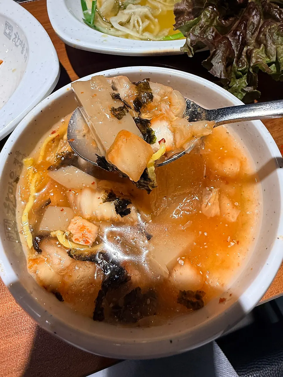 Refreshing acorn jelly cold soup served alongside the meat