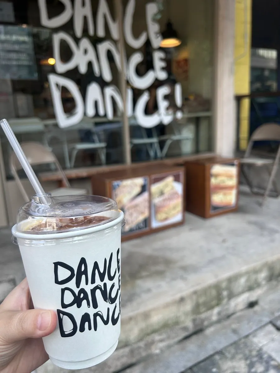 A cup of oat milk latte packed to go