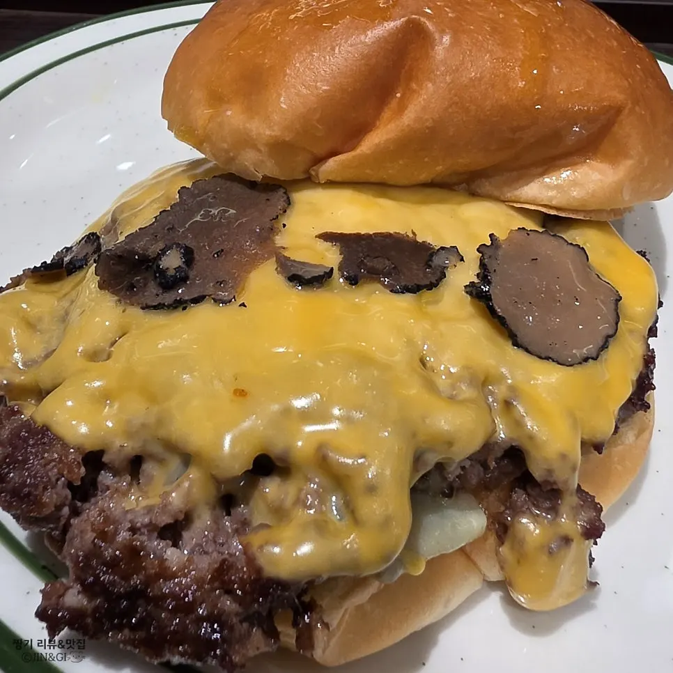 Cross-section of burger showing truffle mayo sauce