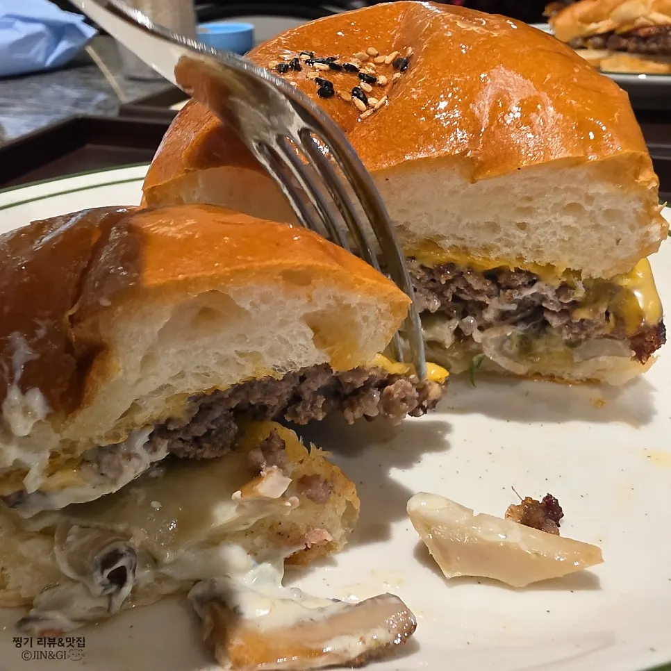 Two burgers placed together on the table