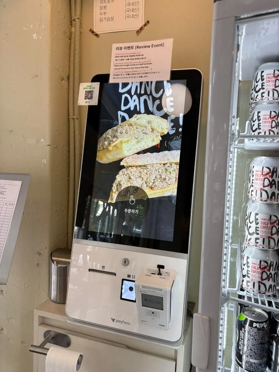 Customers waiting to order inside the shop