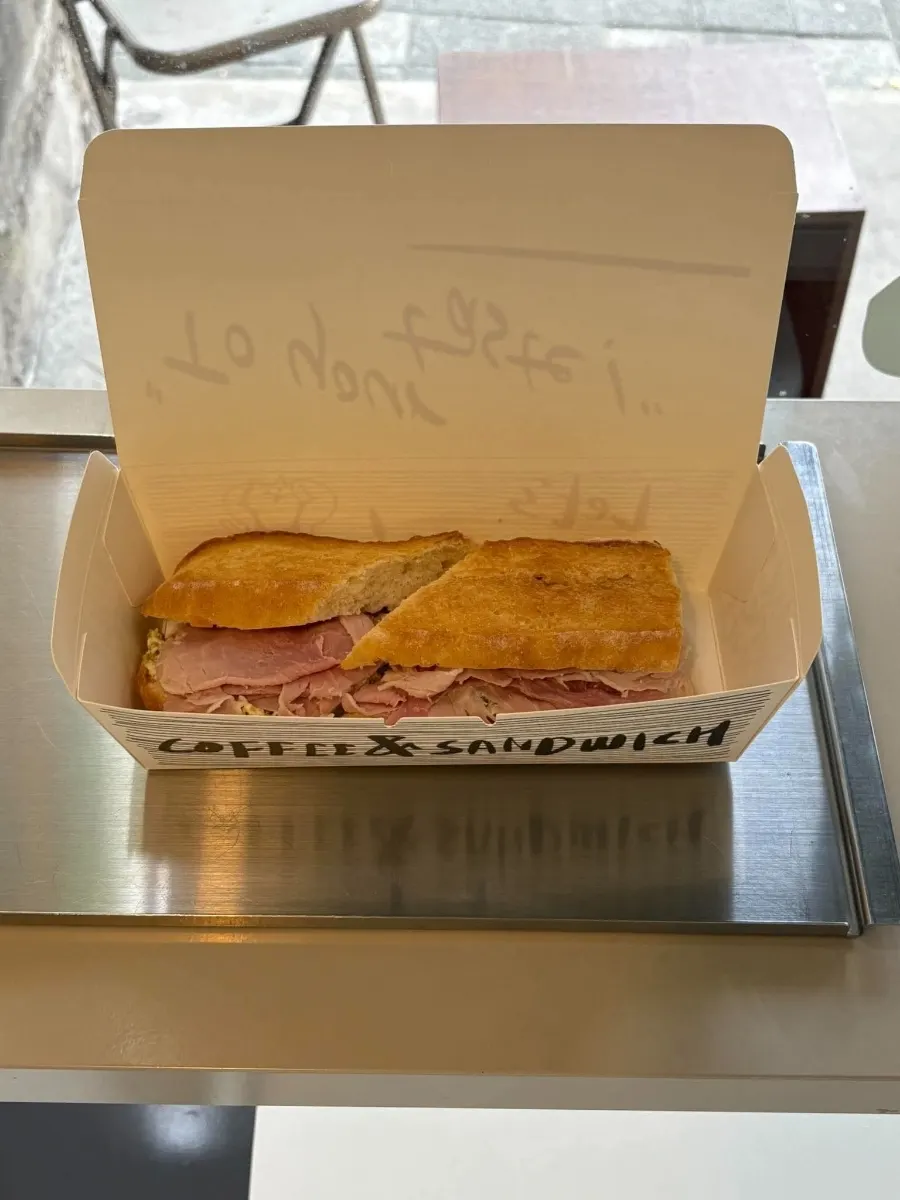 The sandwich served alongside milk