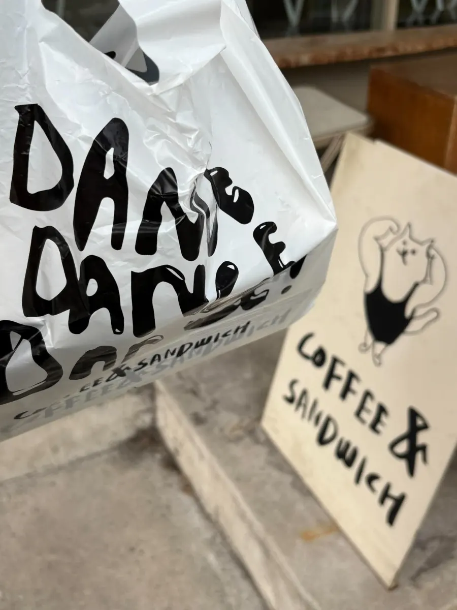 A baguette sandwich with a bite taken out of it