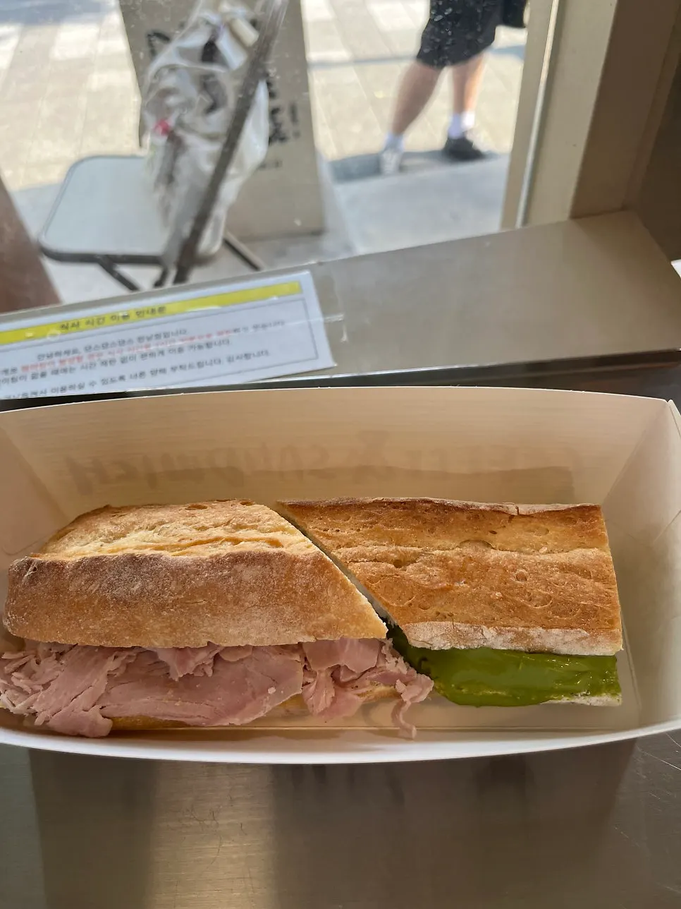 One plate with two sandwiches split and mixed together