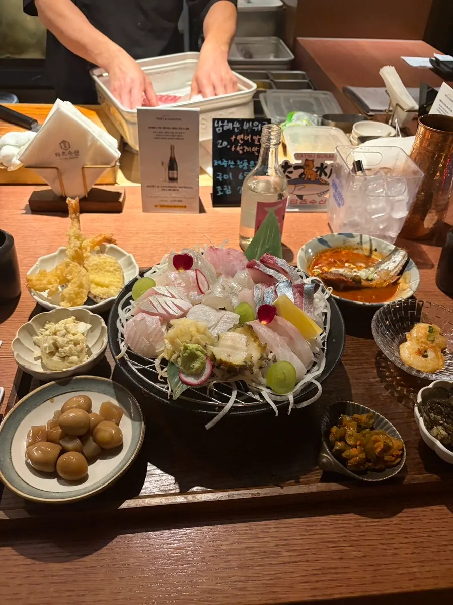 Table fully spread with aged sashimi set