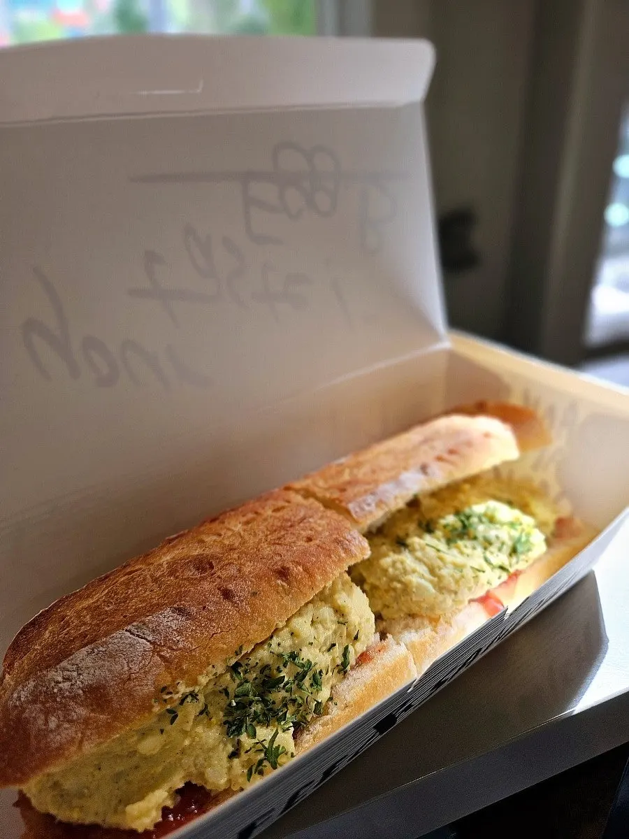Muscular cat sign and egg mayo sandwich
