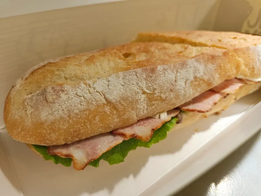 Ham, cheese, and vegetable baguette sandwich