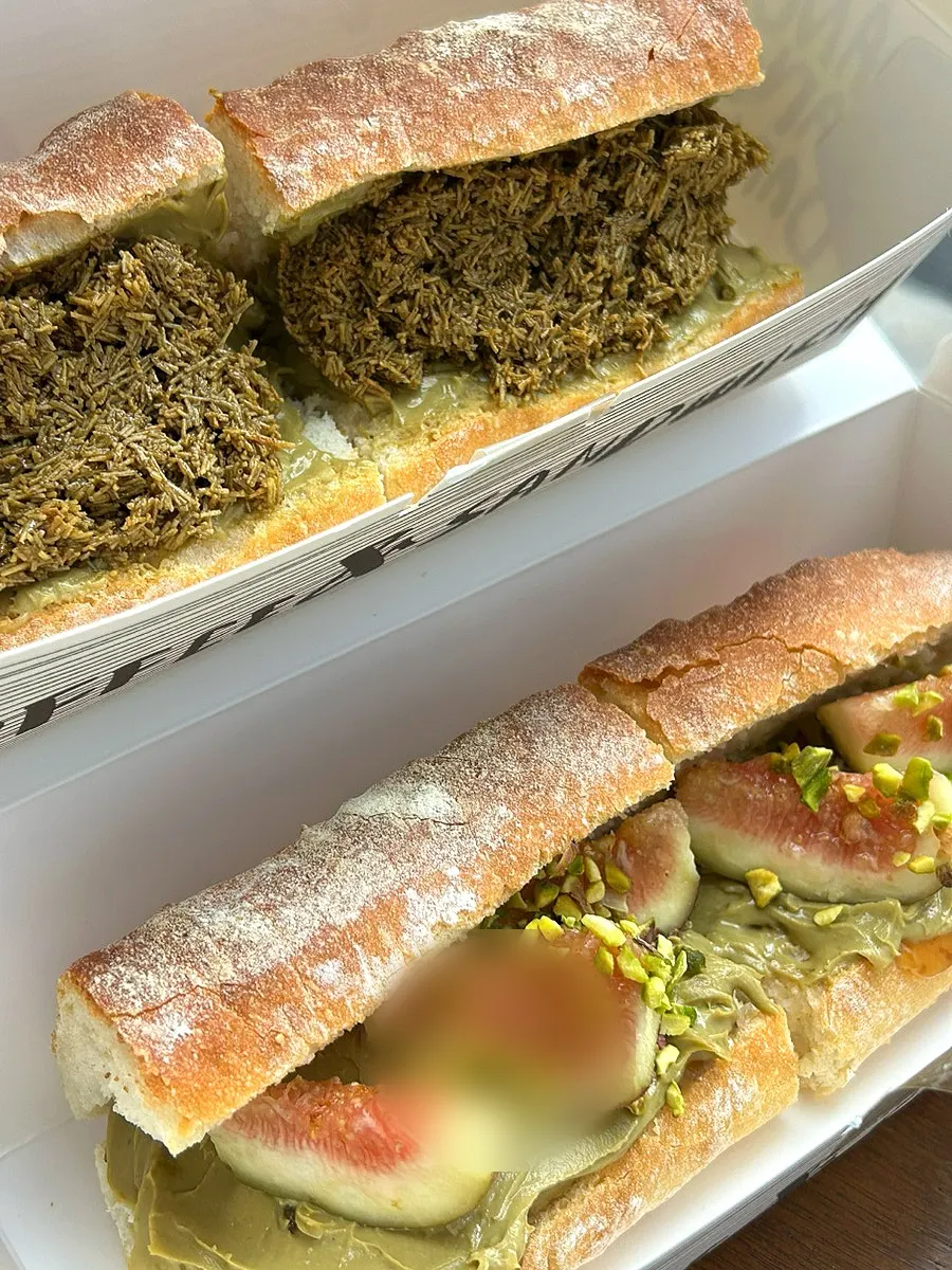 Two Dance Dance Dance baguettes in a takeout box
