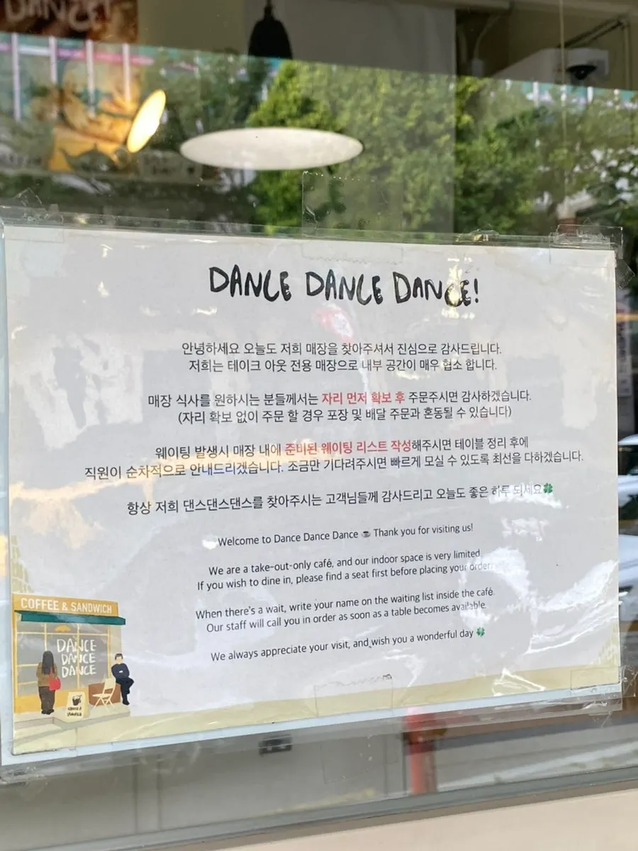 Sign in front of the shop noting dine-in is available