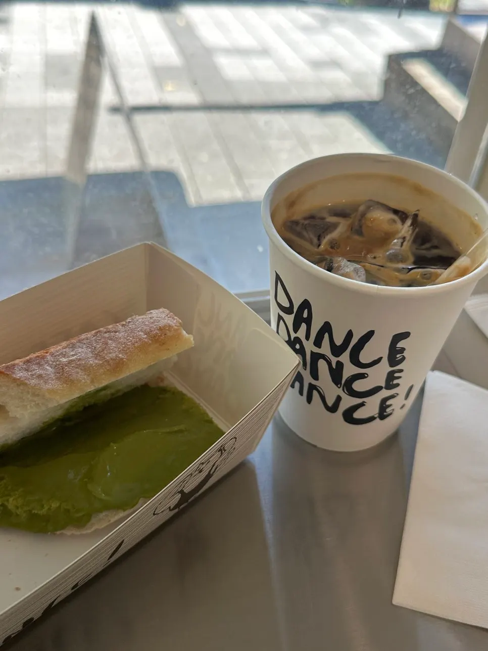 Matcha tofu cream cheese baguette left partly unfinished due to its large portion