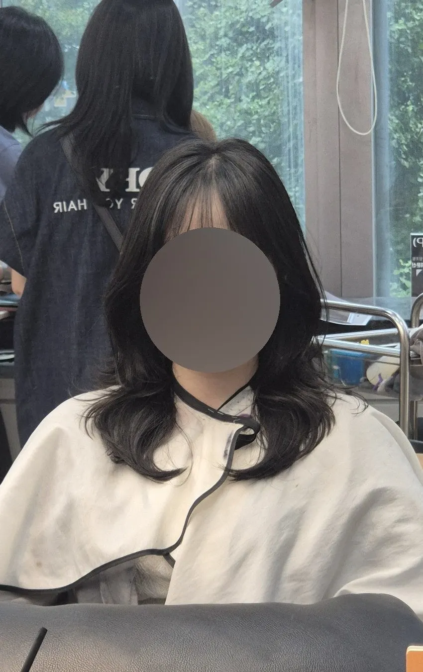 Back view showing the C-curl after the bangs perm