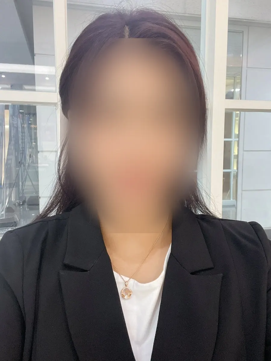 Thick, heavy-looking hair before the cut
