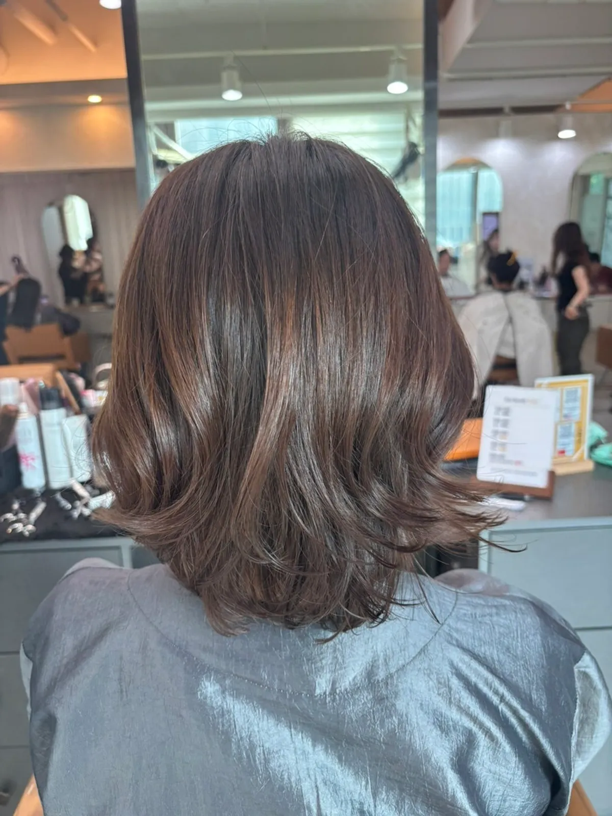 Finished layered bob perm with naturally falling curl
