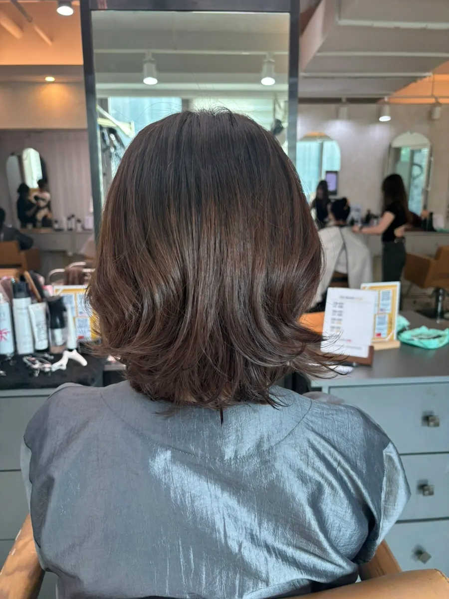 Side line of the perm designed around hair characteristics