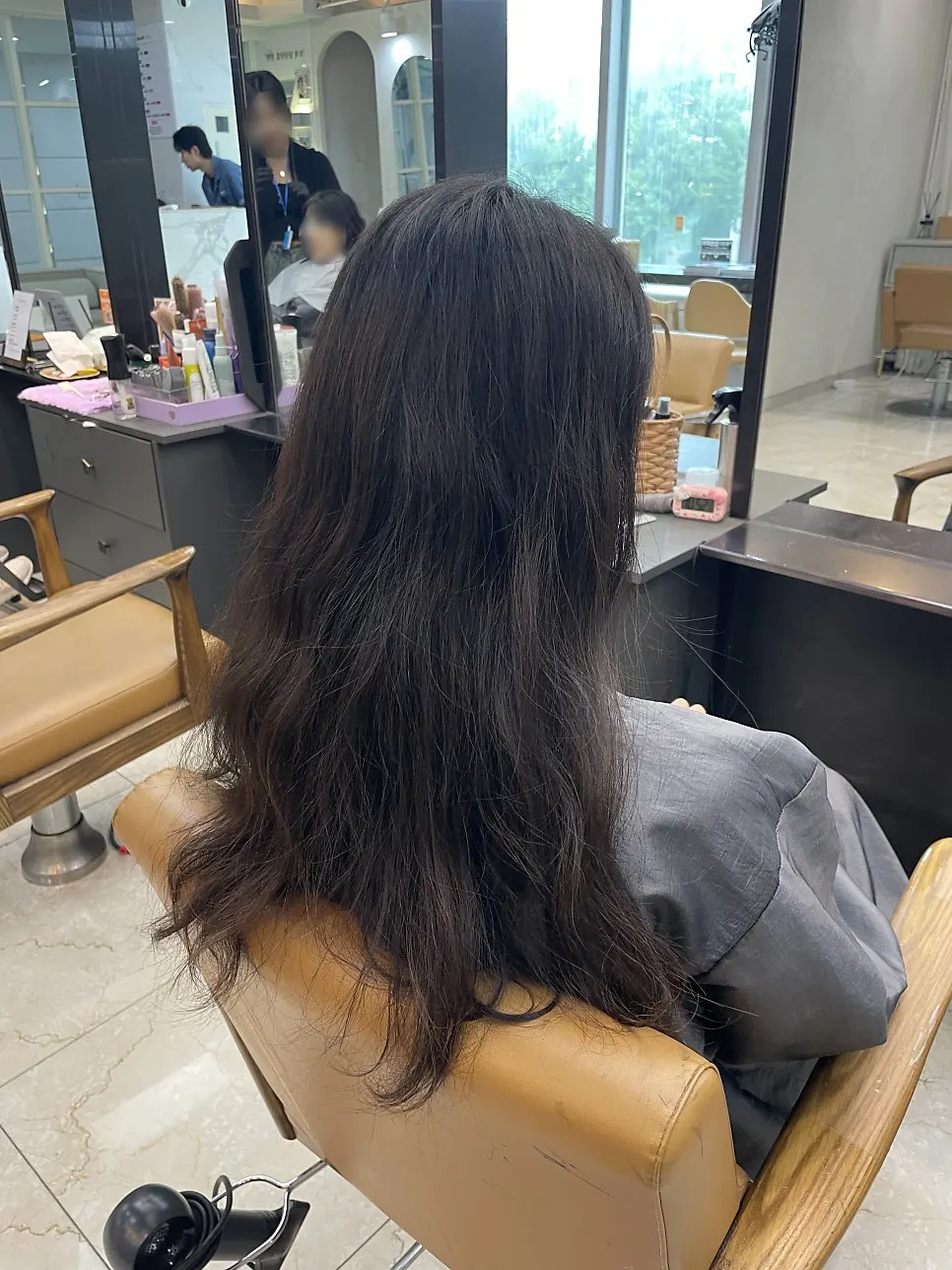 Bangs and face-framing pieces styled to finish the look