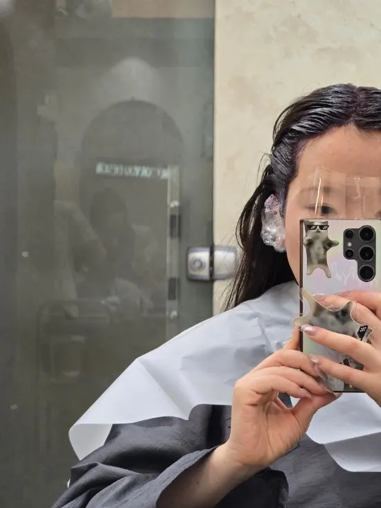 Separate dye formulas mixed for roots and overall hair