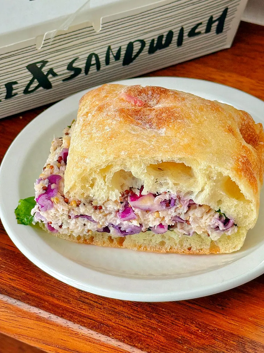 Shredded chicken breast and cabbage filling visible