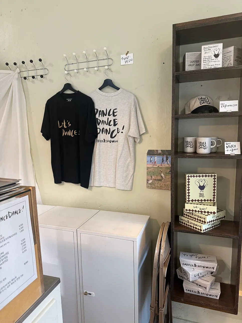 Wall displaying goods like t-shirts and mugs