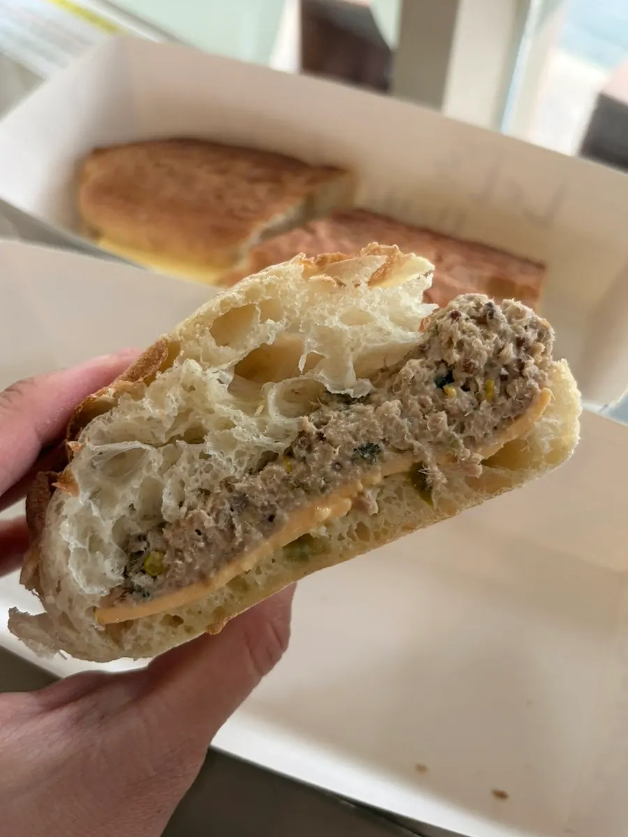 Close-up of the tuna topping on chewy bread