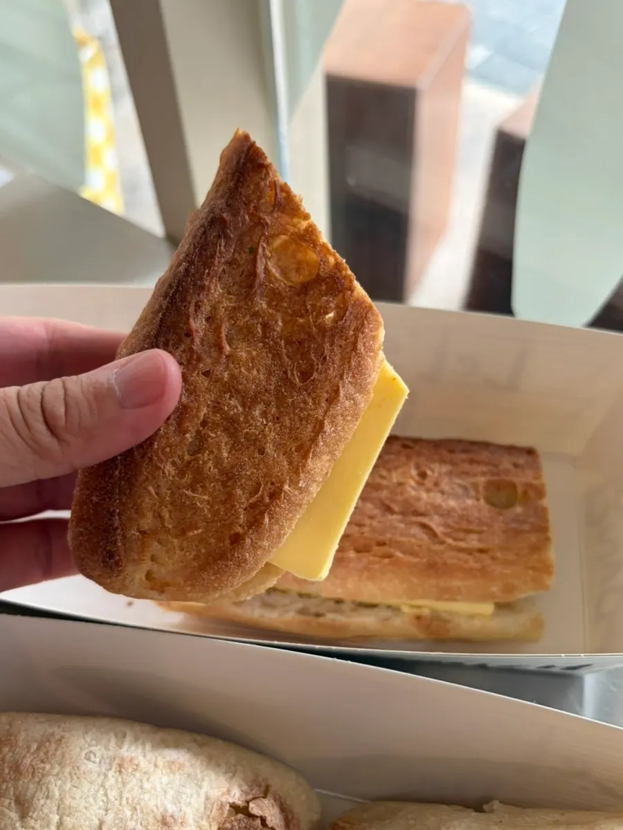 Holding the honey butter baguette