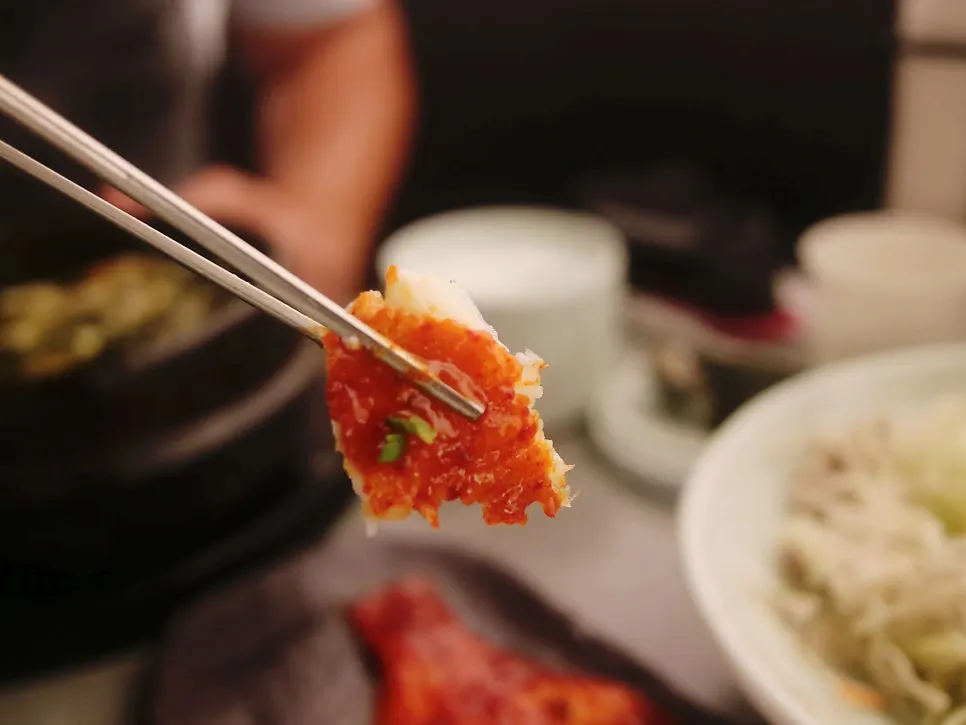 Flounder flesh pulled apart with chopsticks