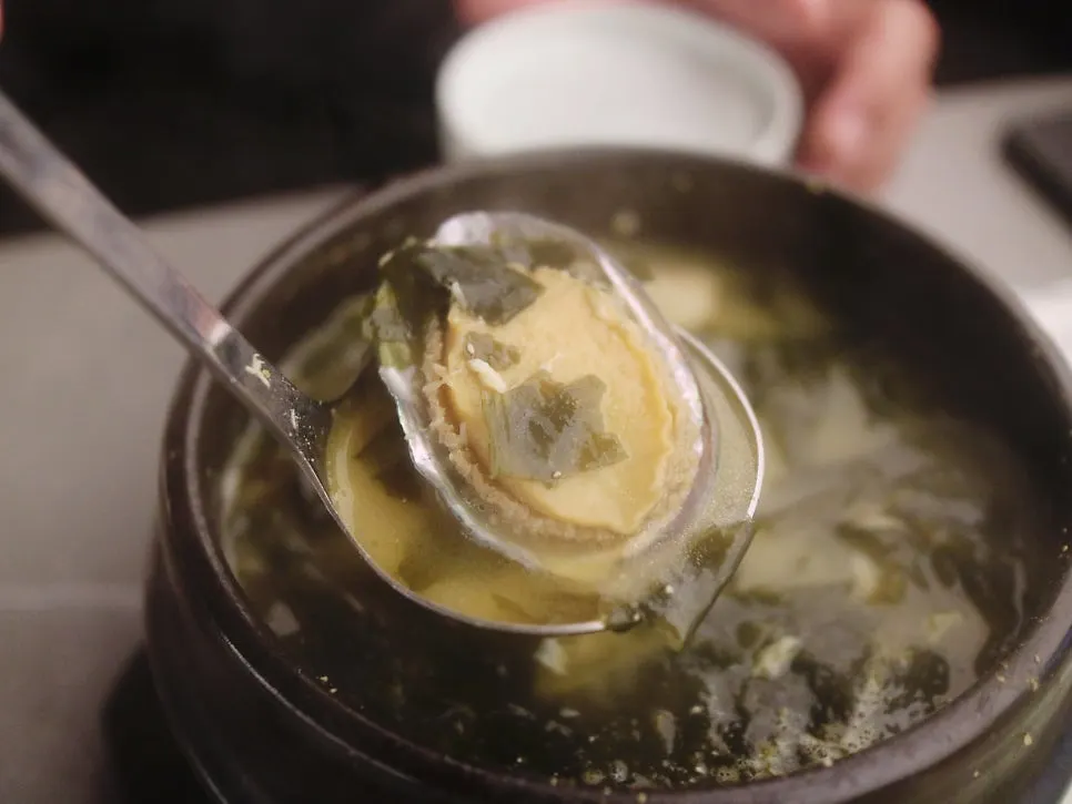 Close-up of seaweed soup with abalone