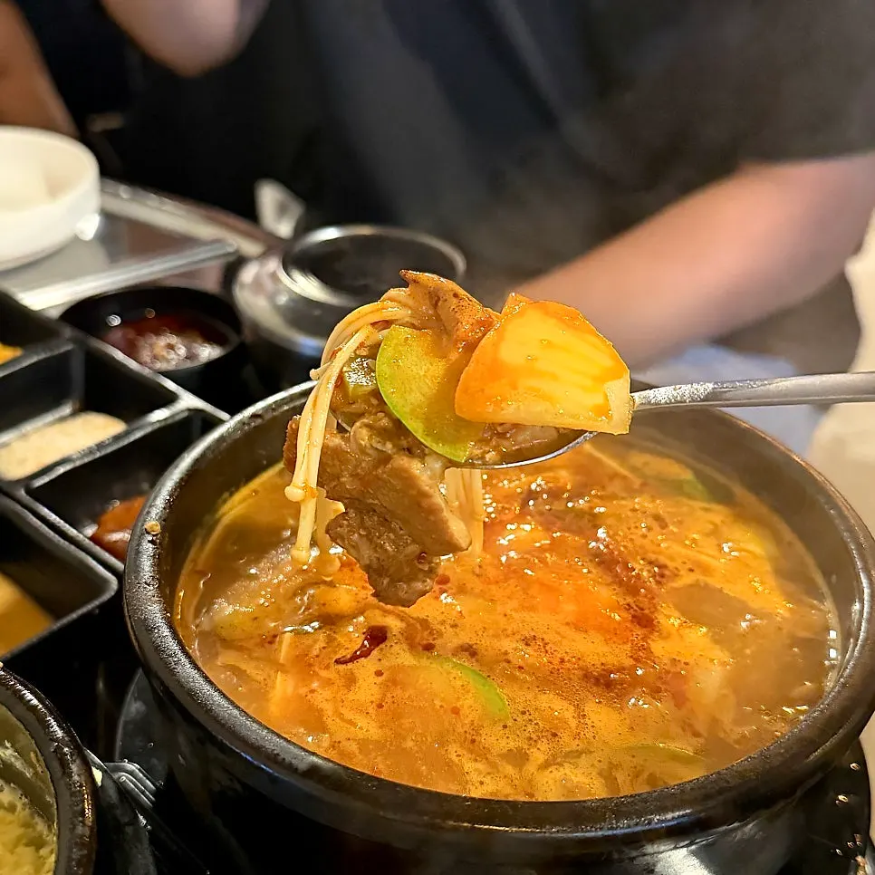 Well-cooked meat inside the doenjang jjigae