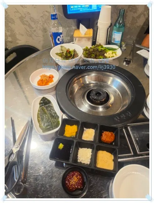 Side dishes of lettuce salad and whole garlic