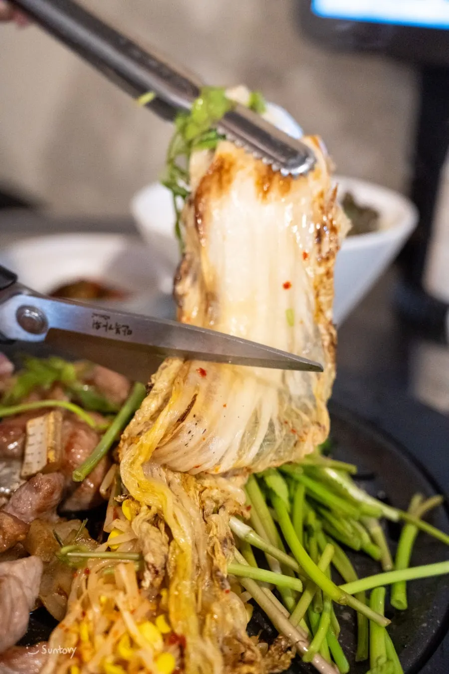 White kimchi and bean sprouts included in the platter