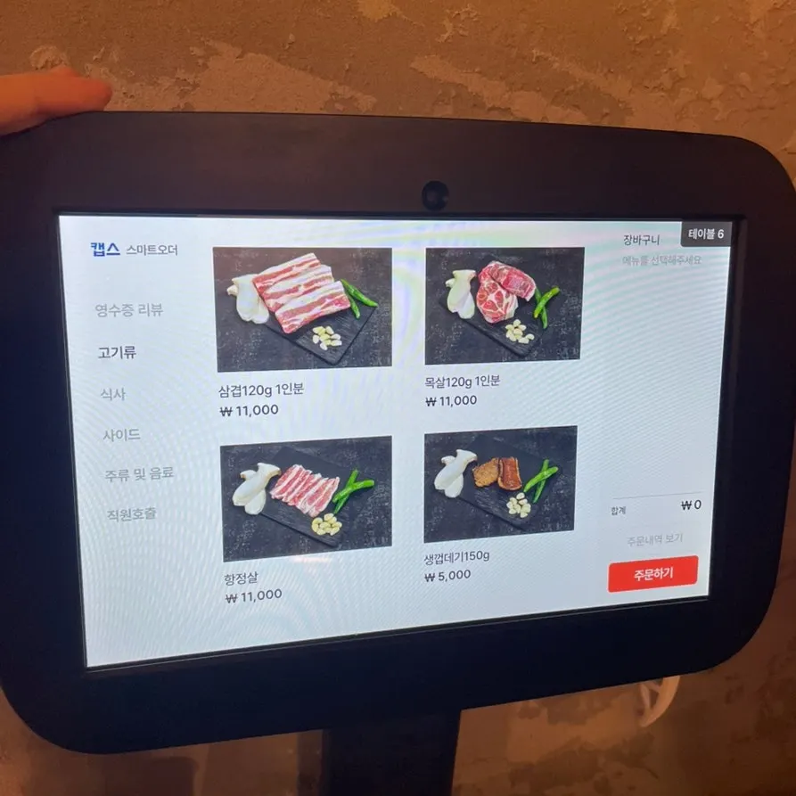 Menu board listing pork and side dishes at Hanpanjip