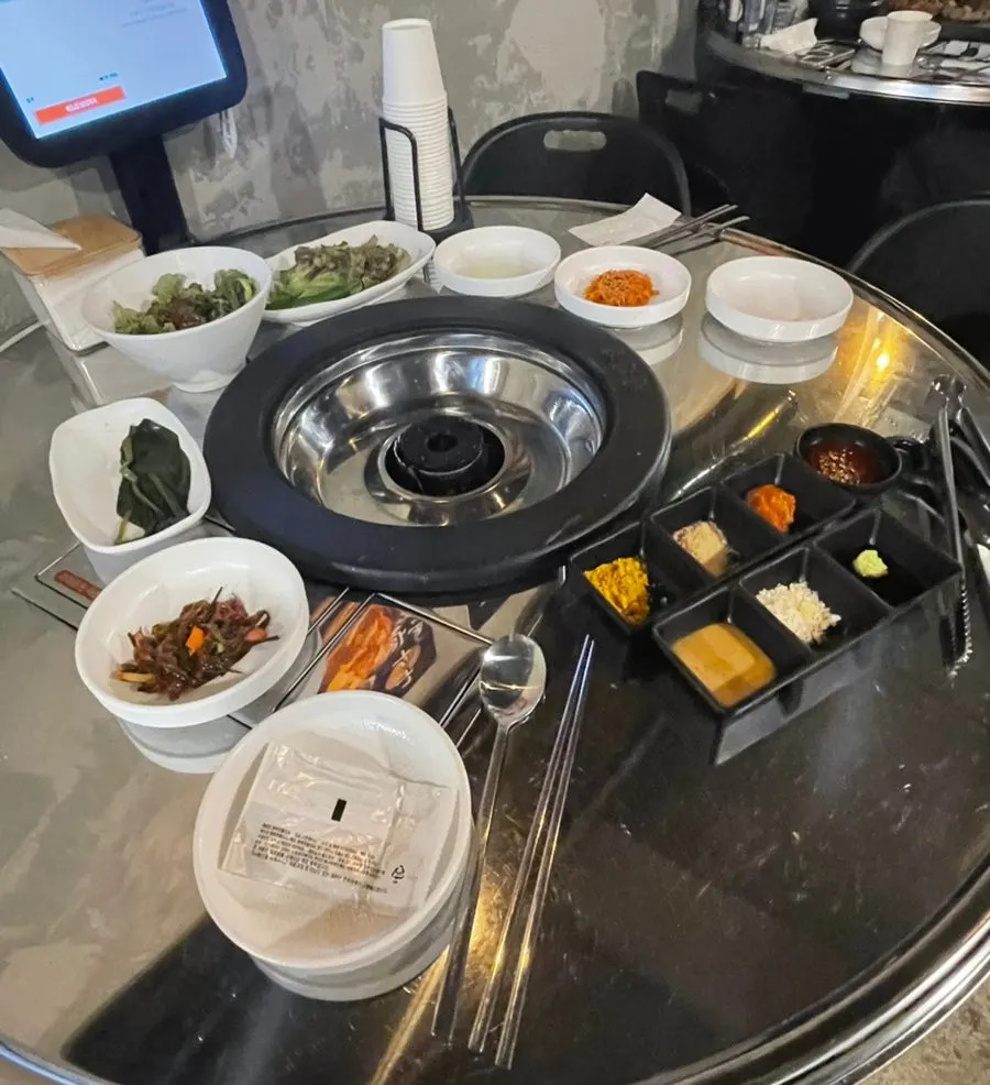 Side dishes and sauces set up by the staff