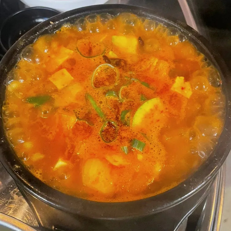 Spicy doenjang rice piled high in a gomtang bowl