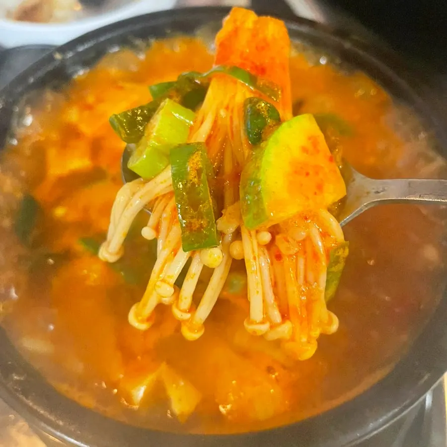 Doenjang rice broth with visible mushrooms and zucchini