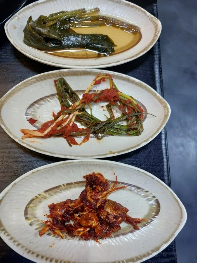 Vertical photo of salty, well-aged side dish plates