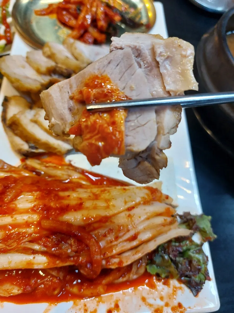 Table densely packed with side dishes