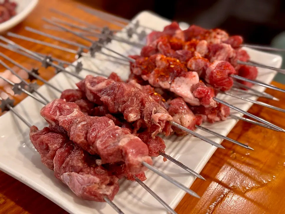 A plate of lamb rib skewers