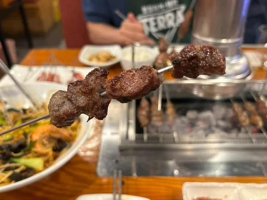 Table set with lamb skewers and mala xiangguo together