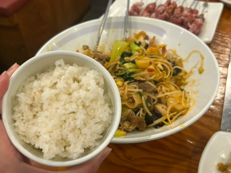 A bowl of mala xiangguo and a bowl of rice