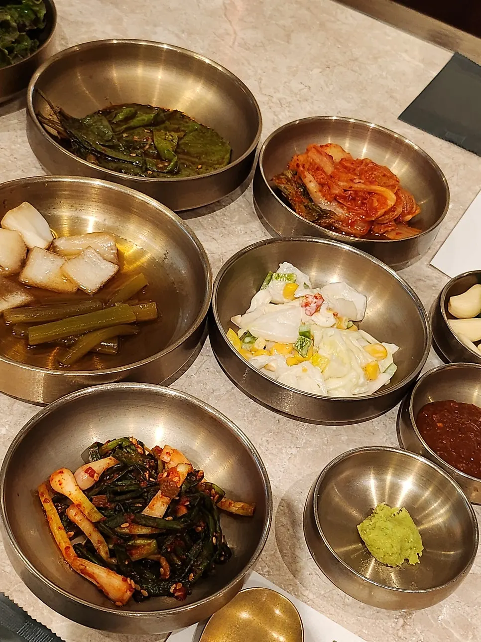 Grabbing side dishes at Hantiok's self-bar