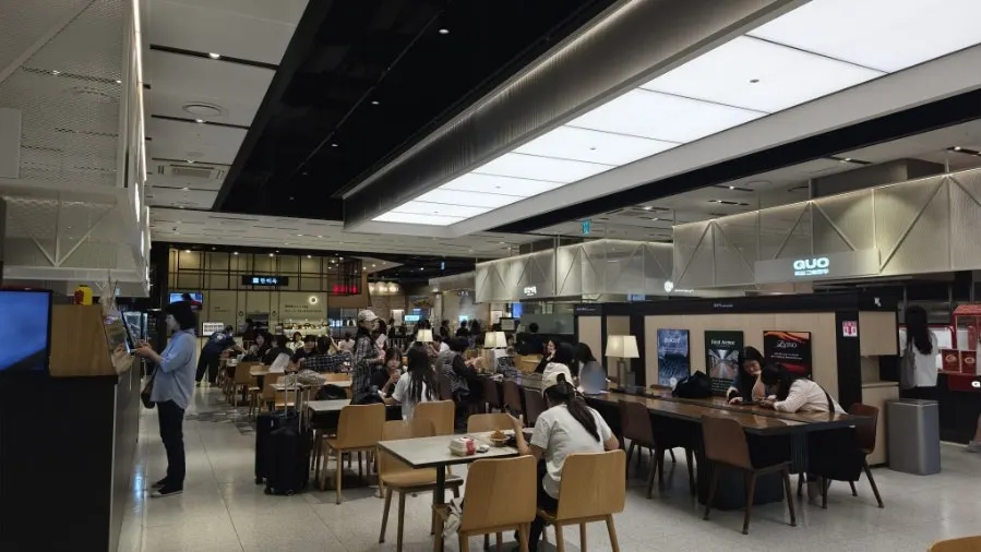 Dedicated seating in front of Hantiok and the surrounding food court space