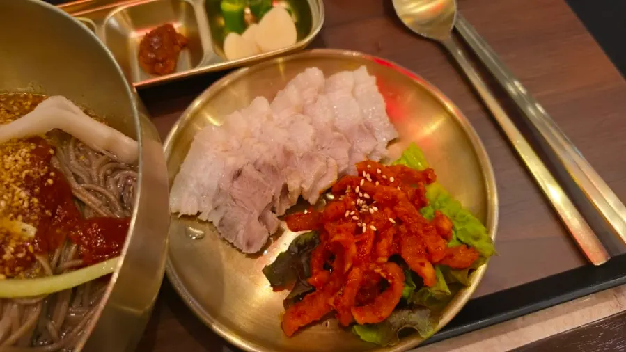 Makguksu set served with bossam and mandu